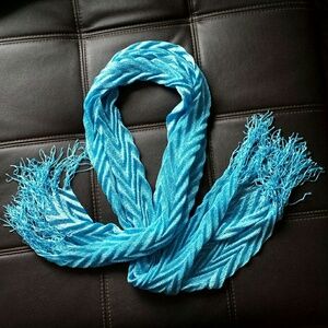 Textured metallic threads in sky blue scarf with fringe